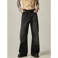 Black loose-fit straight-leg retro jeans with a zip fly on a neutral background.