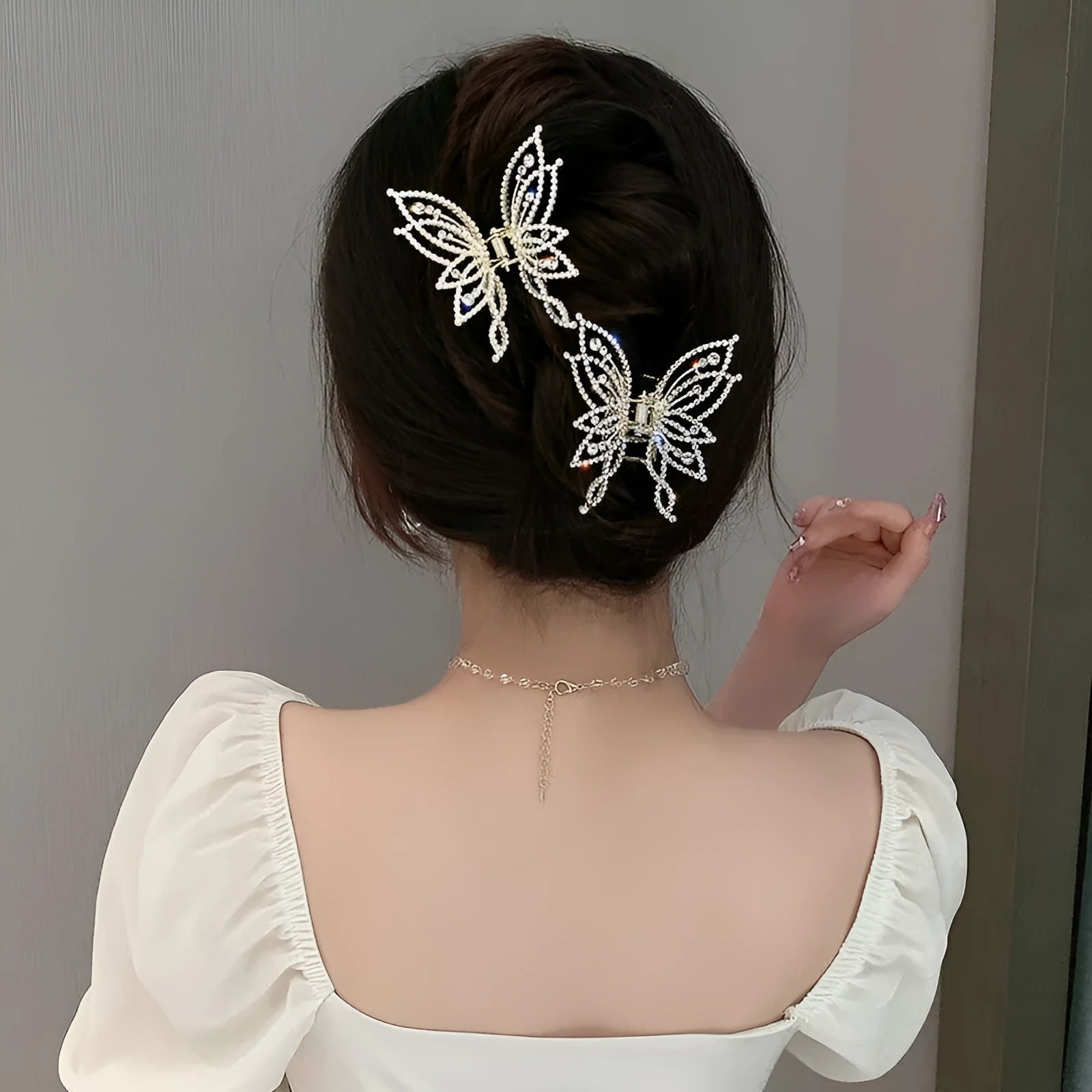 Butterfly hair clip for women with alloy construction and electroplated finish in rhinestone or pearl style