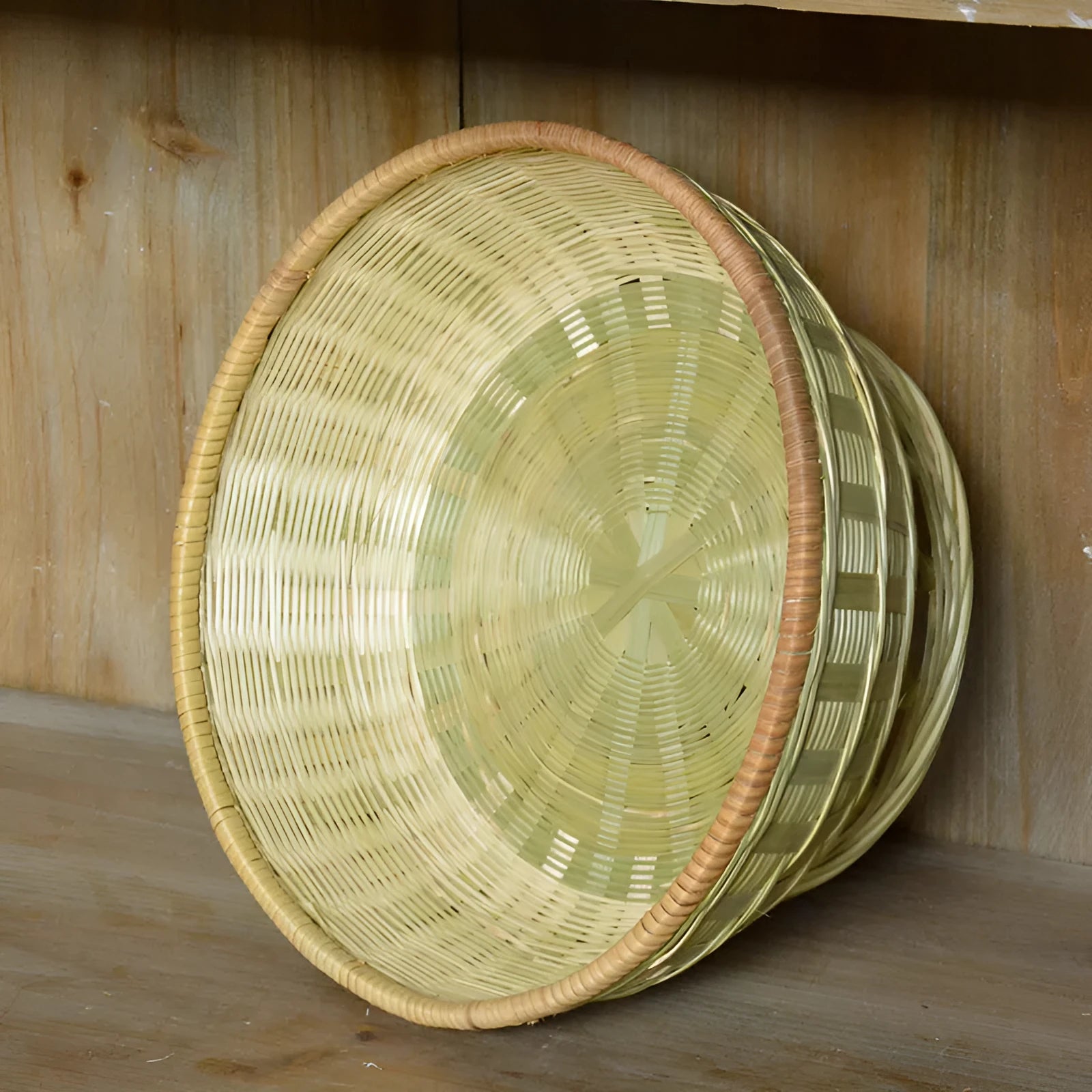 Handmade woven bamboo storage basket in three different sizes for household organisation