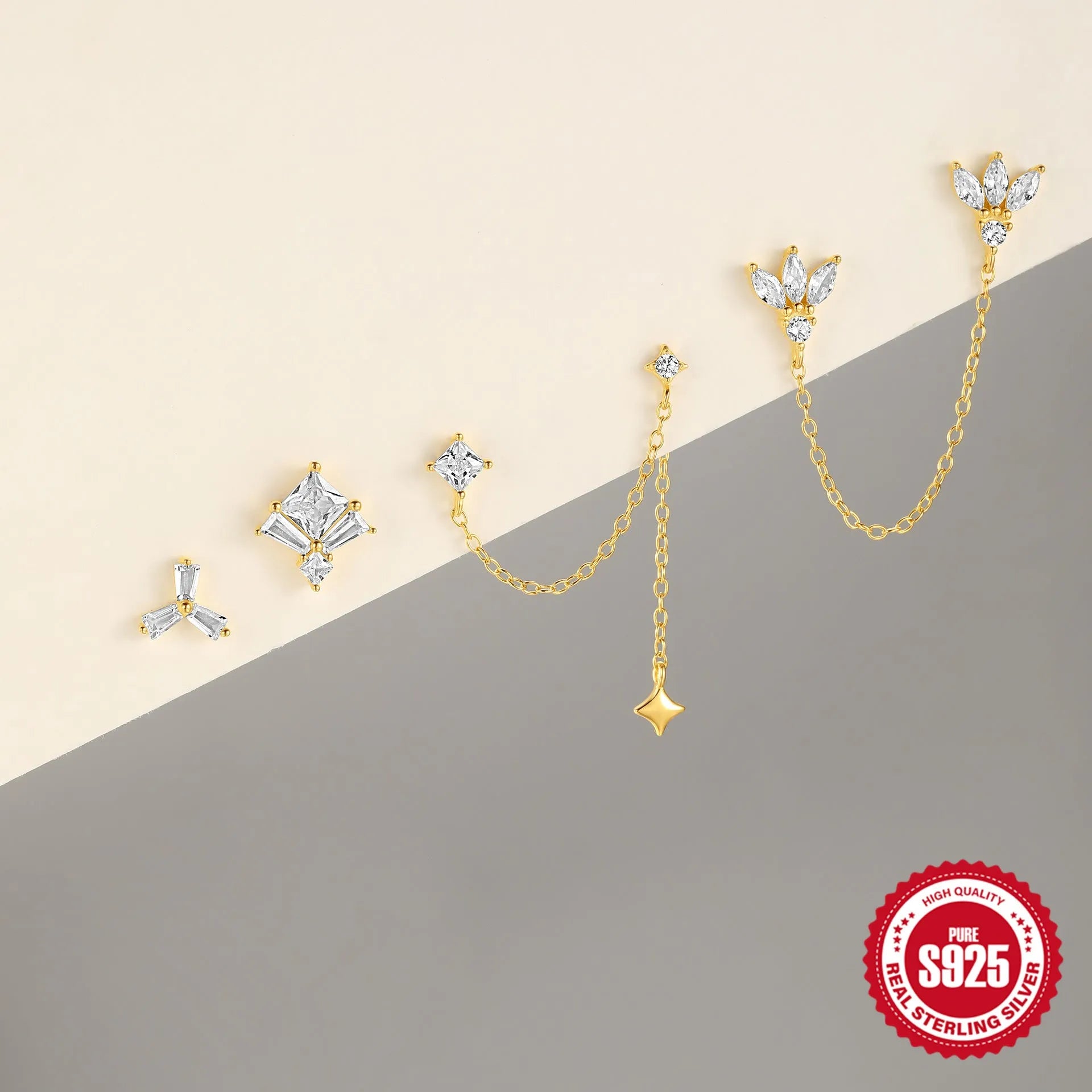 Golden S925 sterling silver earrings with zircon stones in clover, crown, chain, and double piercing designs.