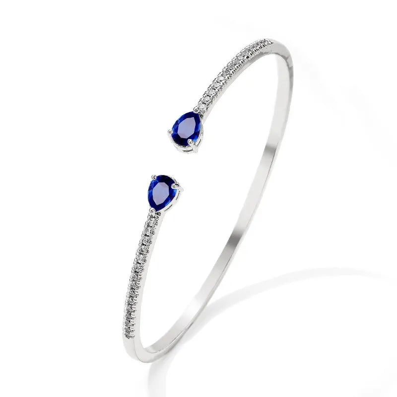 Copper bracelet with zircon inlay treatment in blue colour option