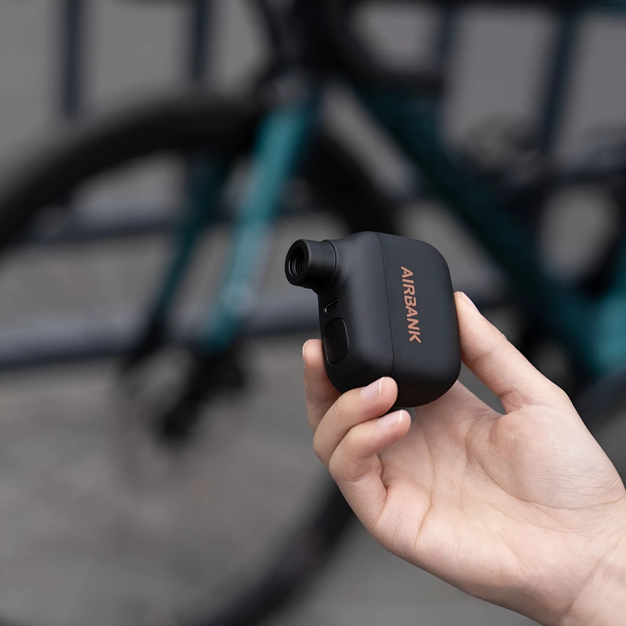 AS100 black electric bicycle pump with USB charging cable and waterproof bag