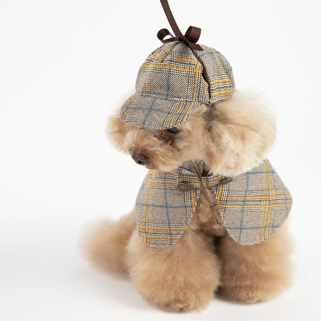 Camel-coloured cotton pet cloak with an adjustable hat shown on a model dog.
