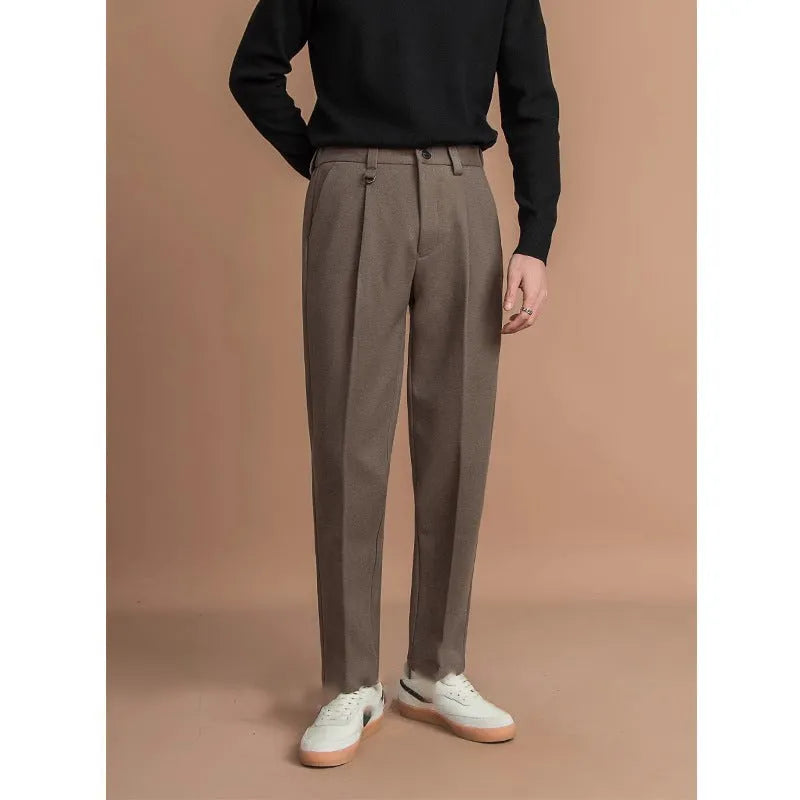 Men's straight-leg trousers in khaki colour on a hanger