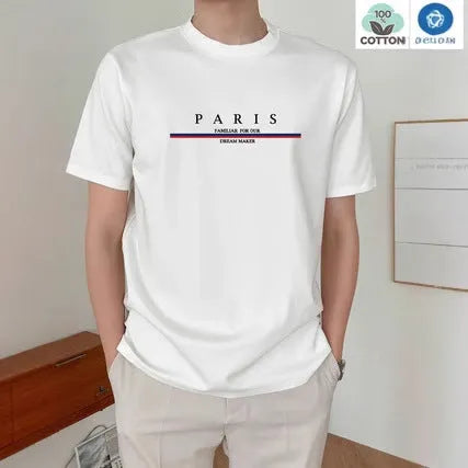 Man wearing a loose-fit short-sleeved t-shirt with a large letter print on the chest in a solid colour.