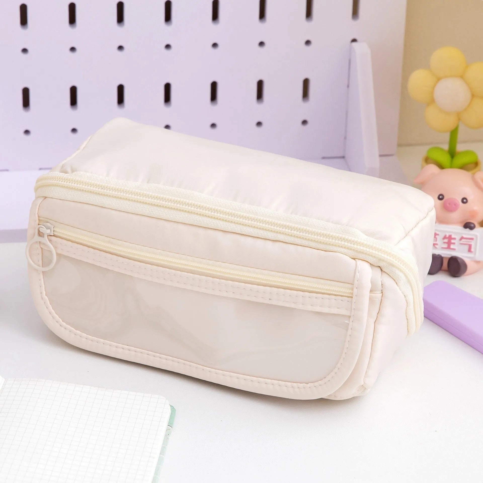 Canvas pencil case with ten flip layers open, showing compartments, in premium Black colour.
