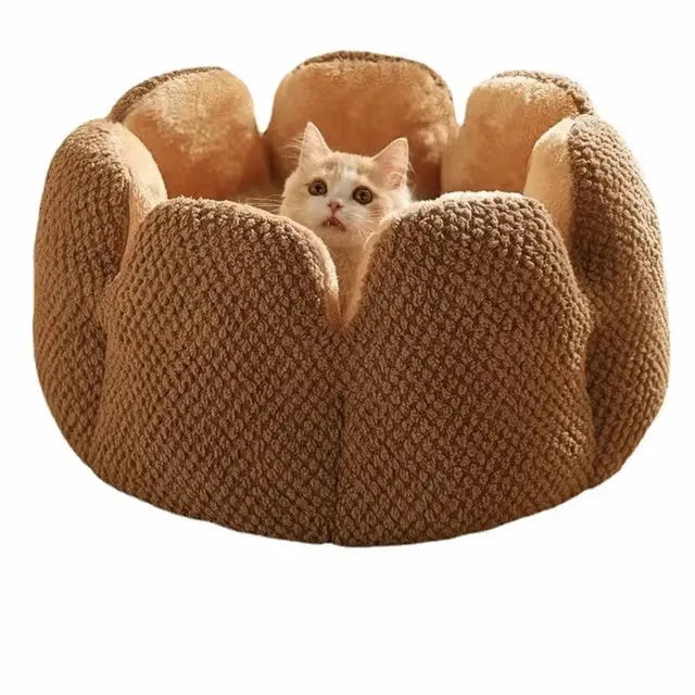Green cactus petal shaped enclosed pet bed for cats and dogs on a hardwood floor.