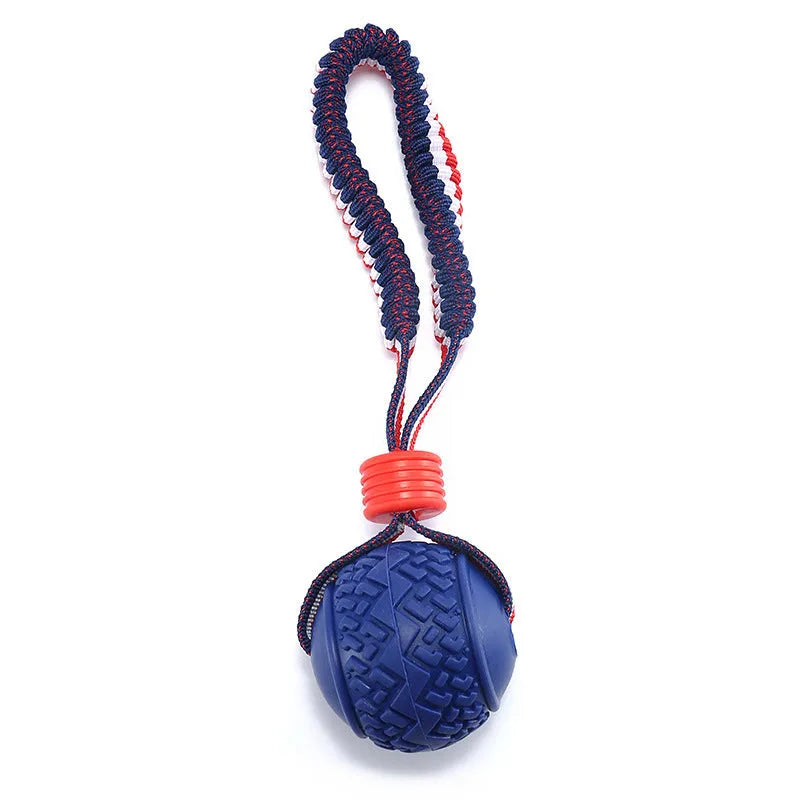Blue and red dog toy with a rubber ball on a rope for tug-of-war and teeth cleaning.