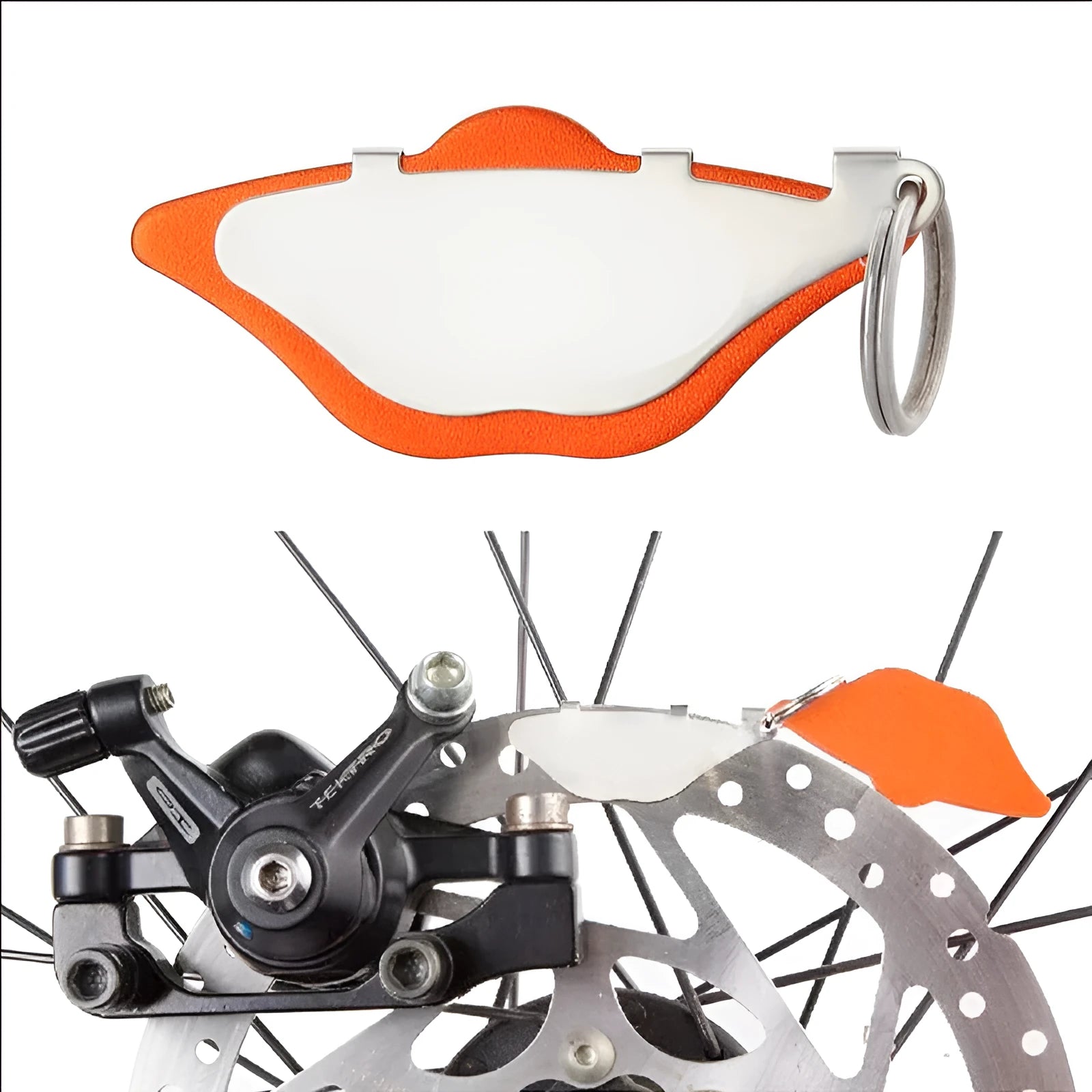 Mountain bike disc brake pads replacement set in black and orange colours with adjustment flap