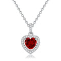 Sterling silver heart necklace with a natural amethyst gemstone on a cross chain.