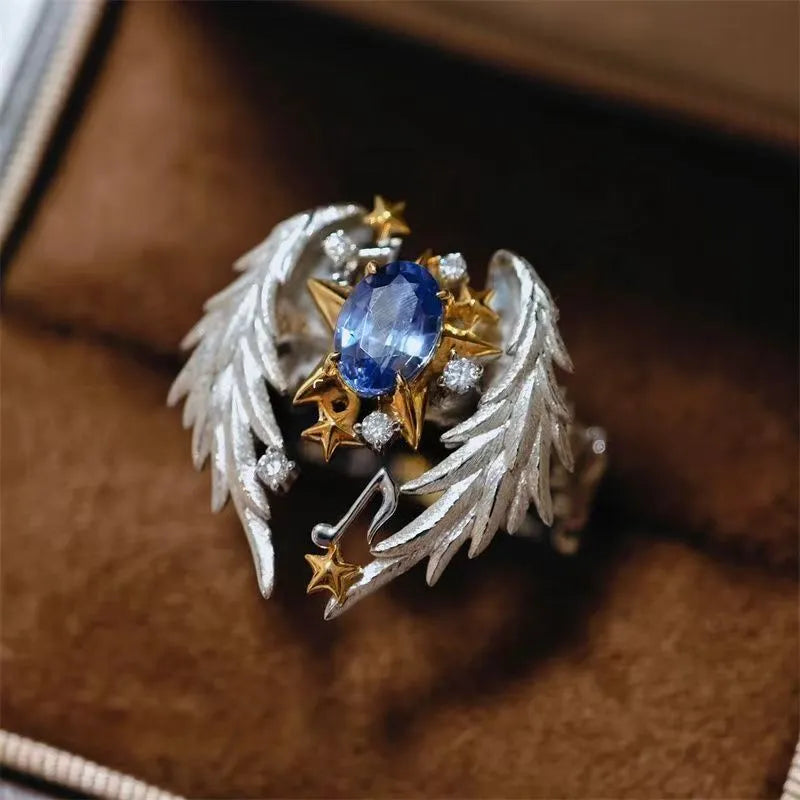 Adjustable ring with geometric angel wings pattern and open mouth design