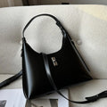 Women's soft genuine leather crossbody shoulder bag in a dumpling shape, shown in a light colour.