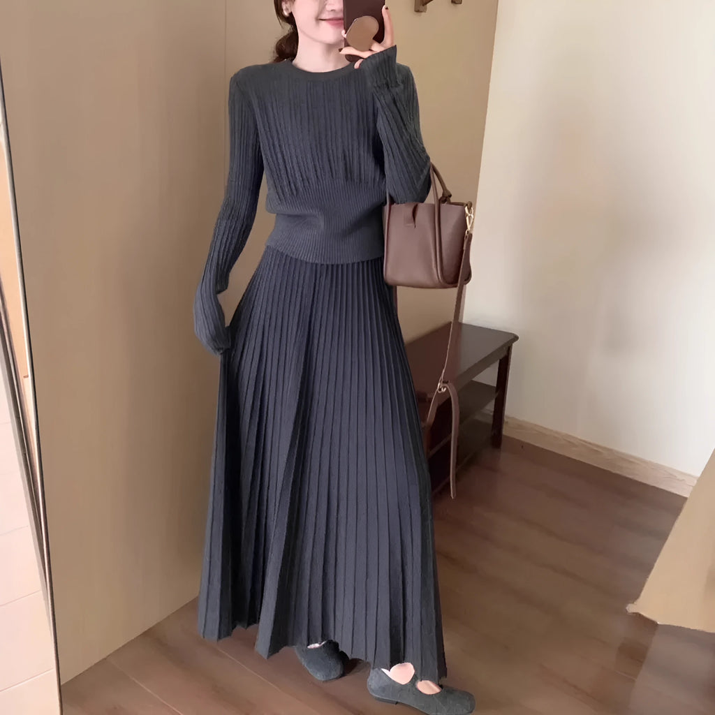 Dark grey knitted women's long dress suit with sweater, skirt, and 3D artistic pattern.