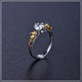 Black gold copper crown crystal ring for cosplay on a grey background.