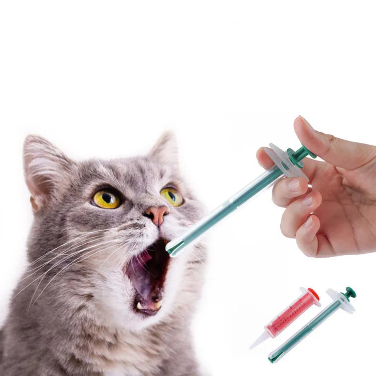 Two pet pill shooters with soft silicone tips, different sizes, for administering medicine to cats and dogs.