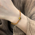 Natural yellow tiger's eye and Hetian jade bracelet with diamond treatment in U-shaped design