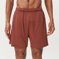 Men's quick-drying nylon running shorts in sky green, shown with mid-waist and short length design.