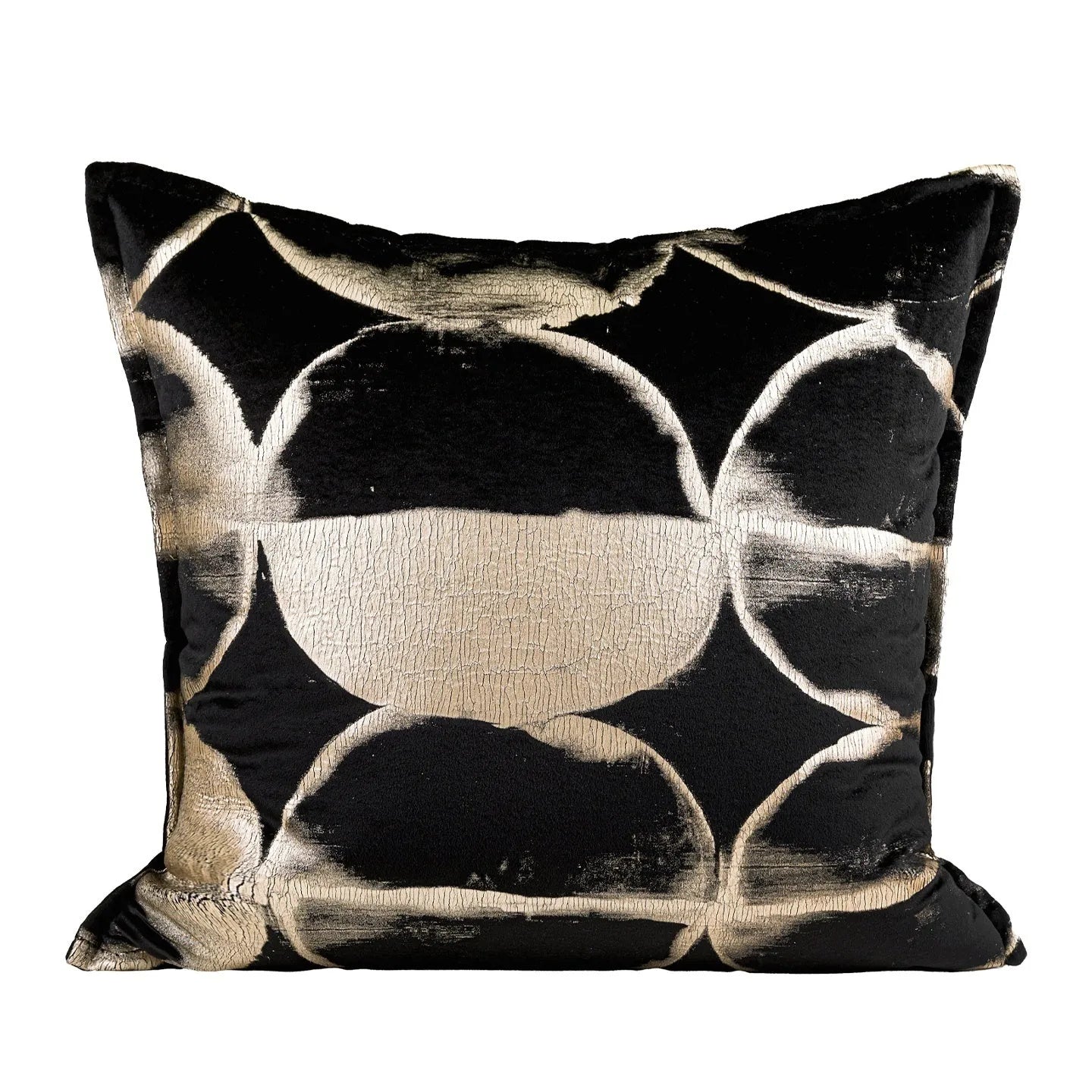 Abstract pattern black and gold decorative cushion pillow with removable cover on a grey sofa.