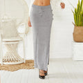Long slim-fit acrylic woolen skirt in black with a side split and strap details on a mannequin.