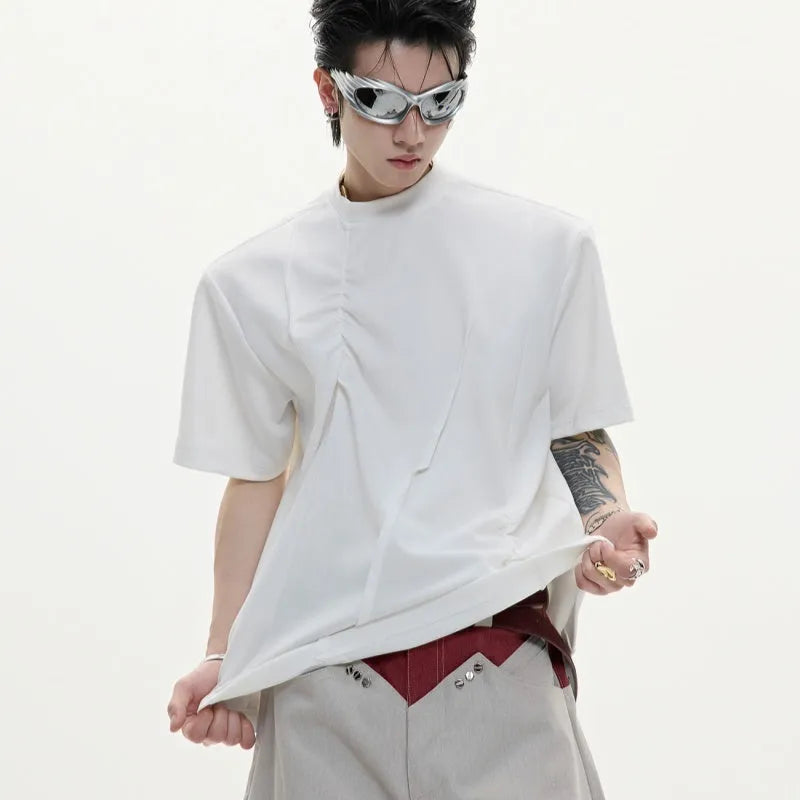 Men's loose grey cotton t-shirt with three-dimensional pleats and asymmetric stitching detail.