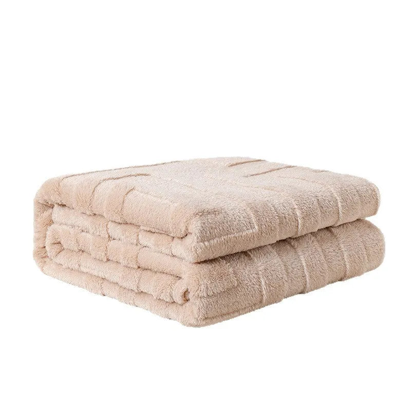 Thick coral fleece flannel blanket folded, showing solid green colour and soft texture.