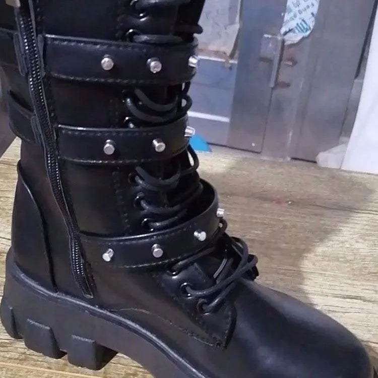 Women's black mid-calf knight boots featuring a metal buckle strap and a side zip closure.