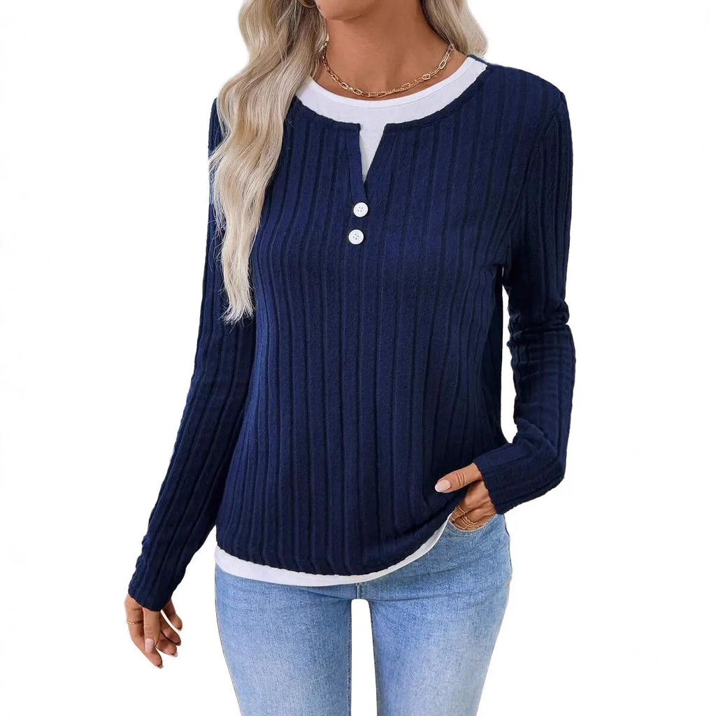 Women's black fake two-piece pullover sweater with button front and round neck on a model.