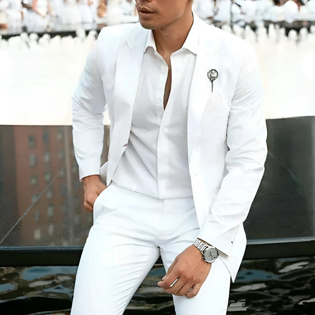 Men's white two-piece wedding suit with slim fit styling and cotton-acetate fabric blend