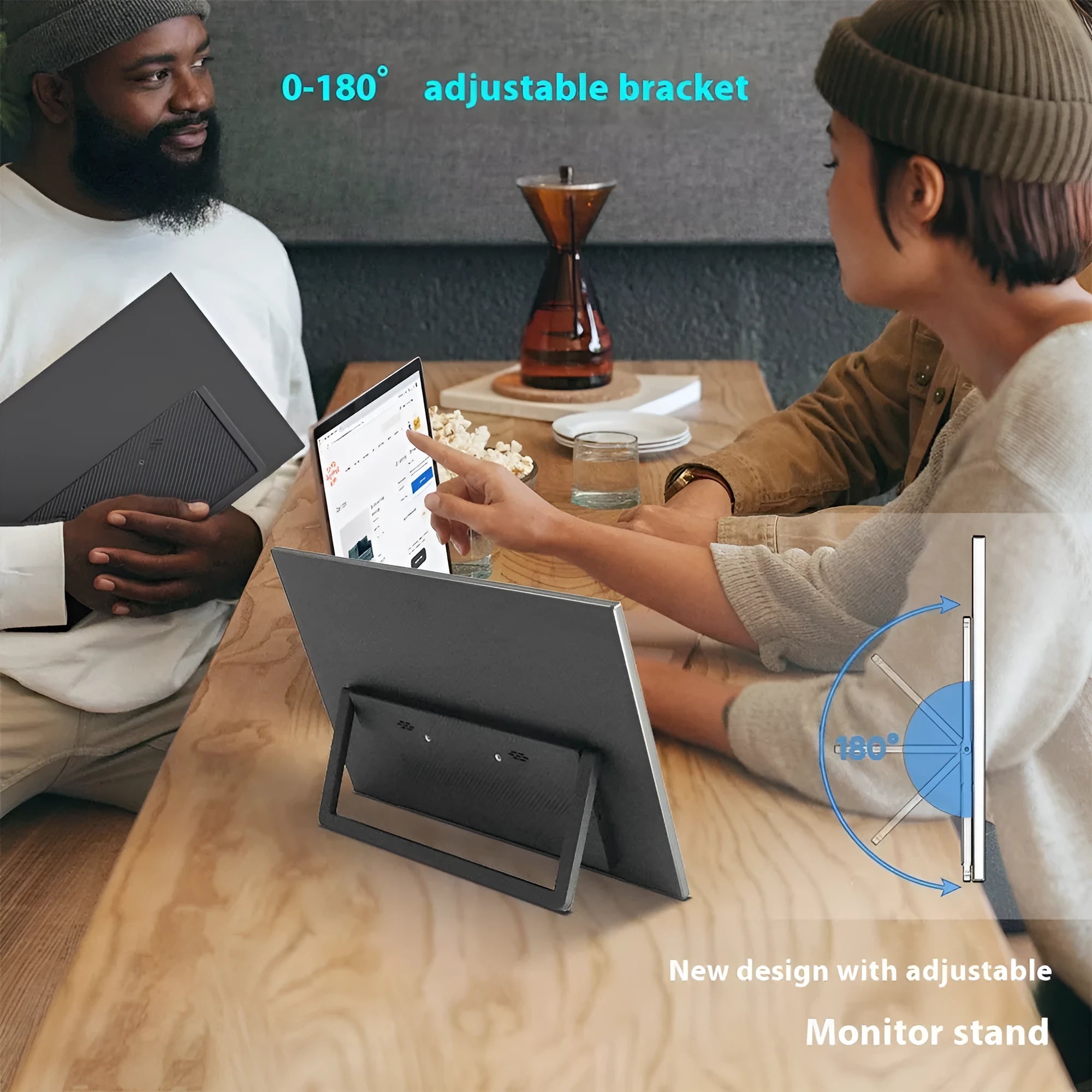 Black 15.6-inch portable monitor with adjustable stand on desk showing office application