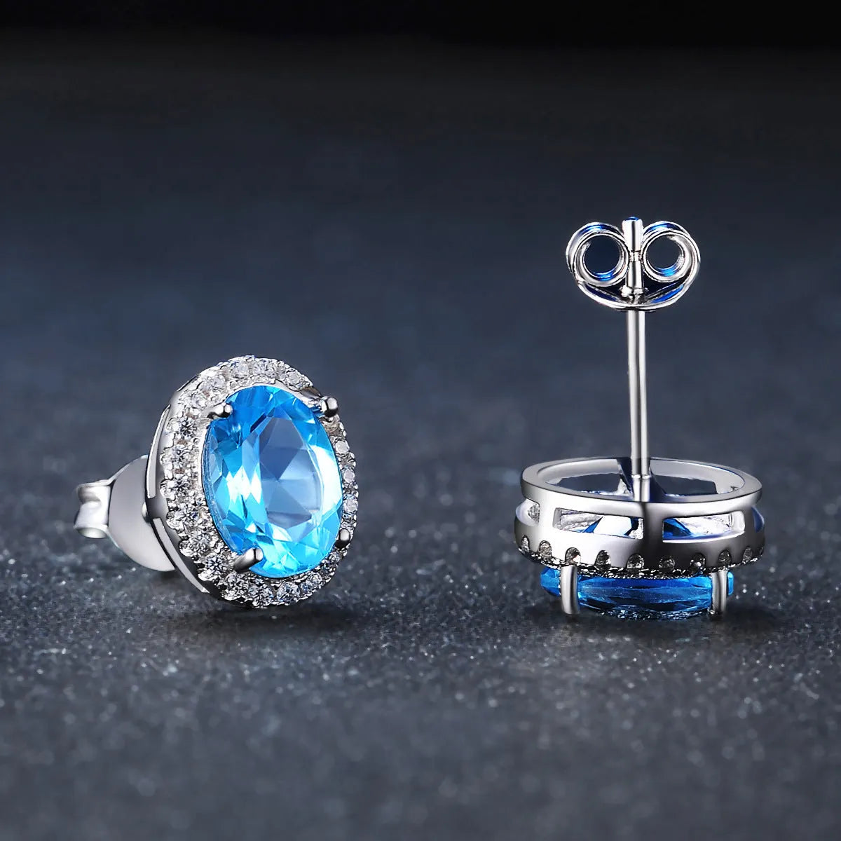 925 sterling silver geometric jewellery set with Blue Topaz gems showing necklace, earrings, ring, and pendant