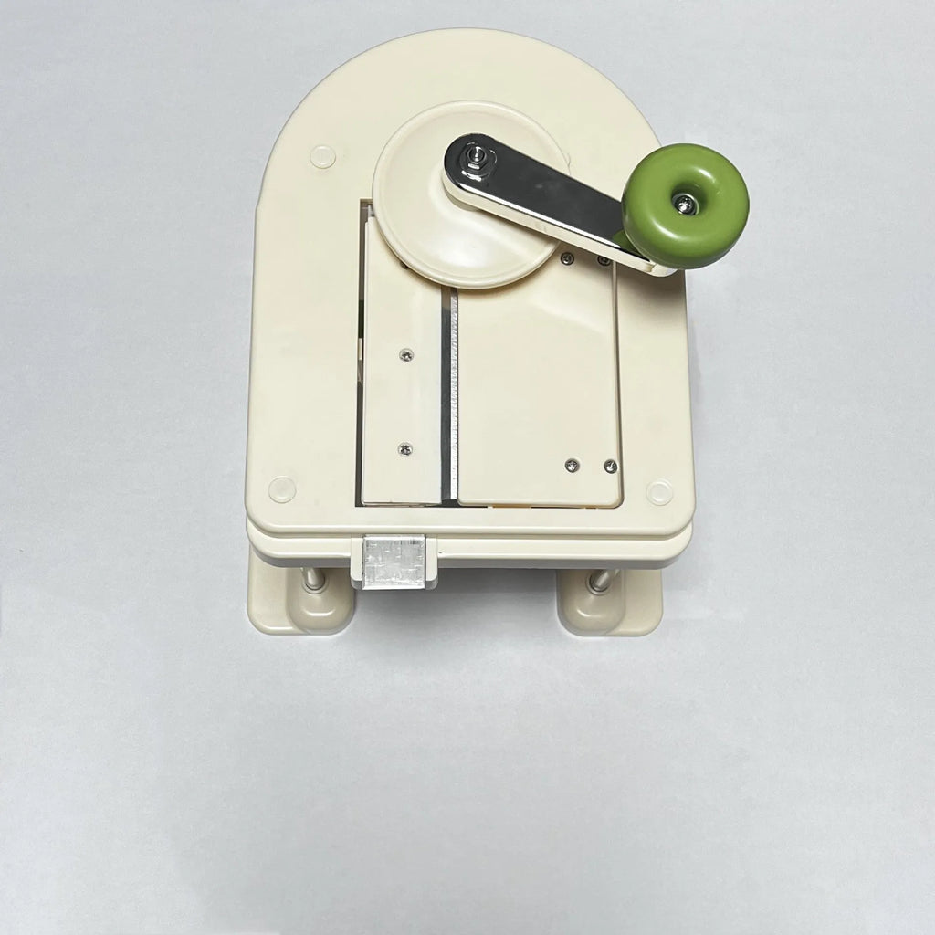 Beige stainless steel vegetable slicer chopper and grater tool for kitchen use