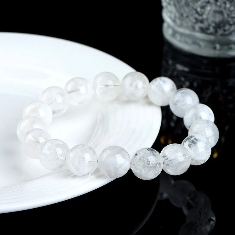 Women's crystal bracelet with natural blizzard snowflake beads featuring Ruyi and Xiangyun Chinese symbols