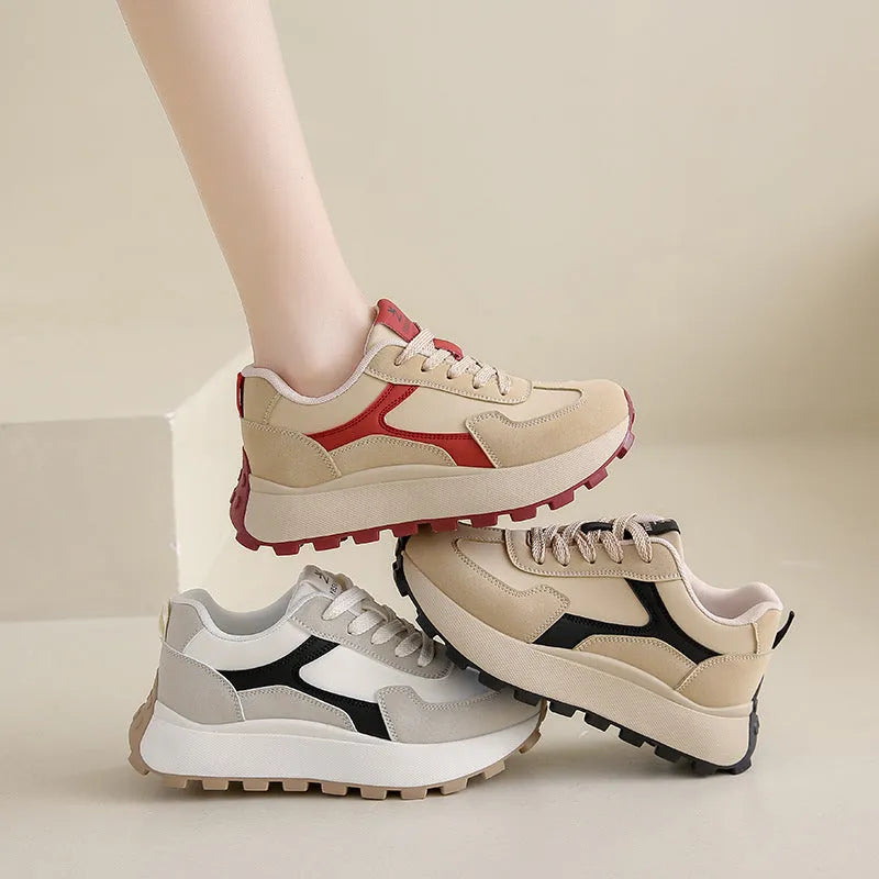 Women's solid colour low top sports shoes with flat platform heel and lace-up front.