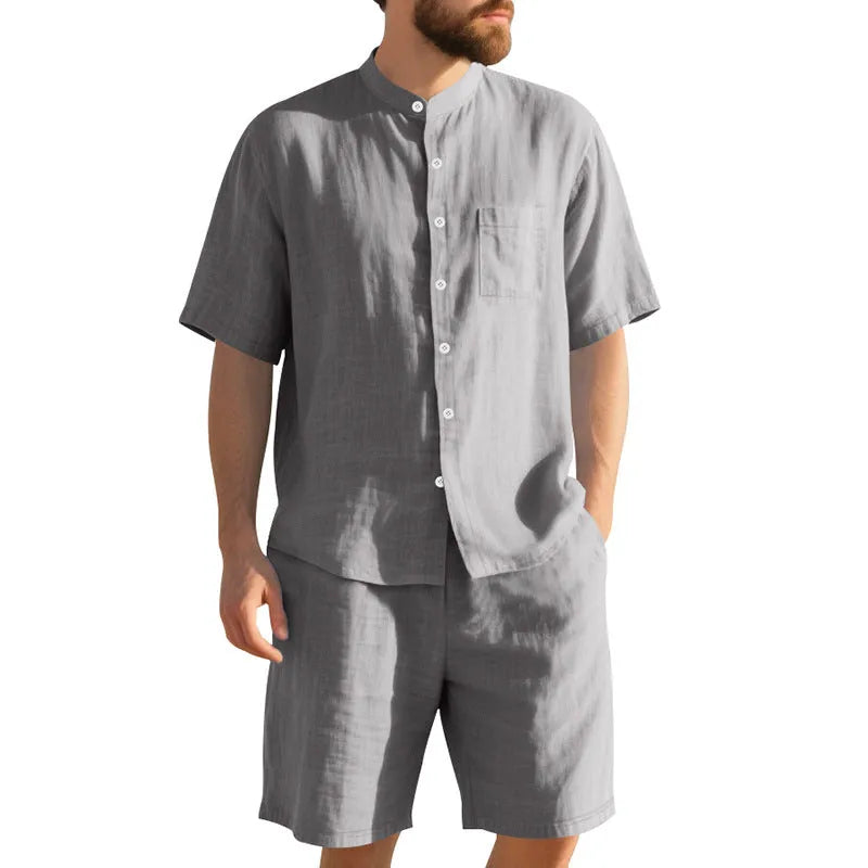 Man wearing a light-coloured short sleeve linen shirt and matching shorts from a casual summer suit set.