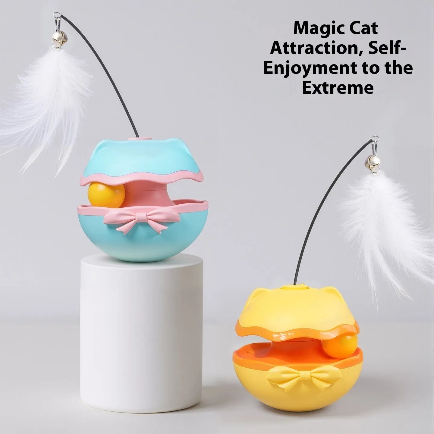 Electric cat toy tumbler in lemon yellow colour with a separate cat teasing stick on a wooden floor.