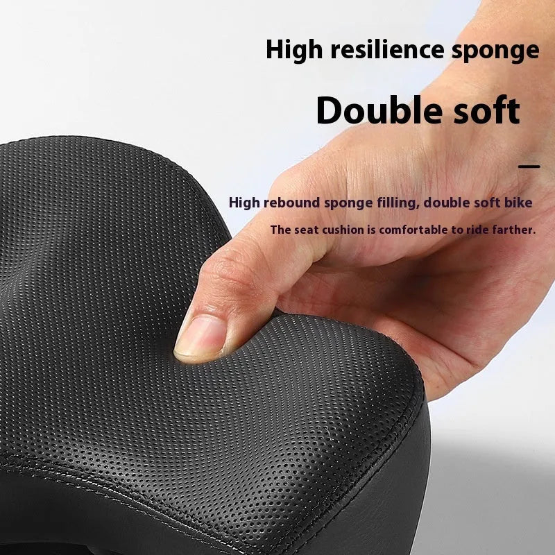 Black leather bicycle seat cushion with thick polyurethane foam padding for shock absorption.