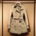 Khaki women's trench coat with double-breasted front and long flight sleeves