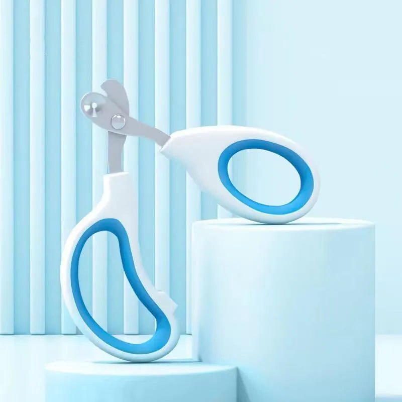 Blue cat nail clippers with a circular guide hole and non-slip grip handle on a white surface.