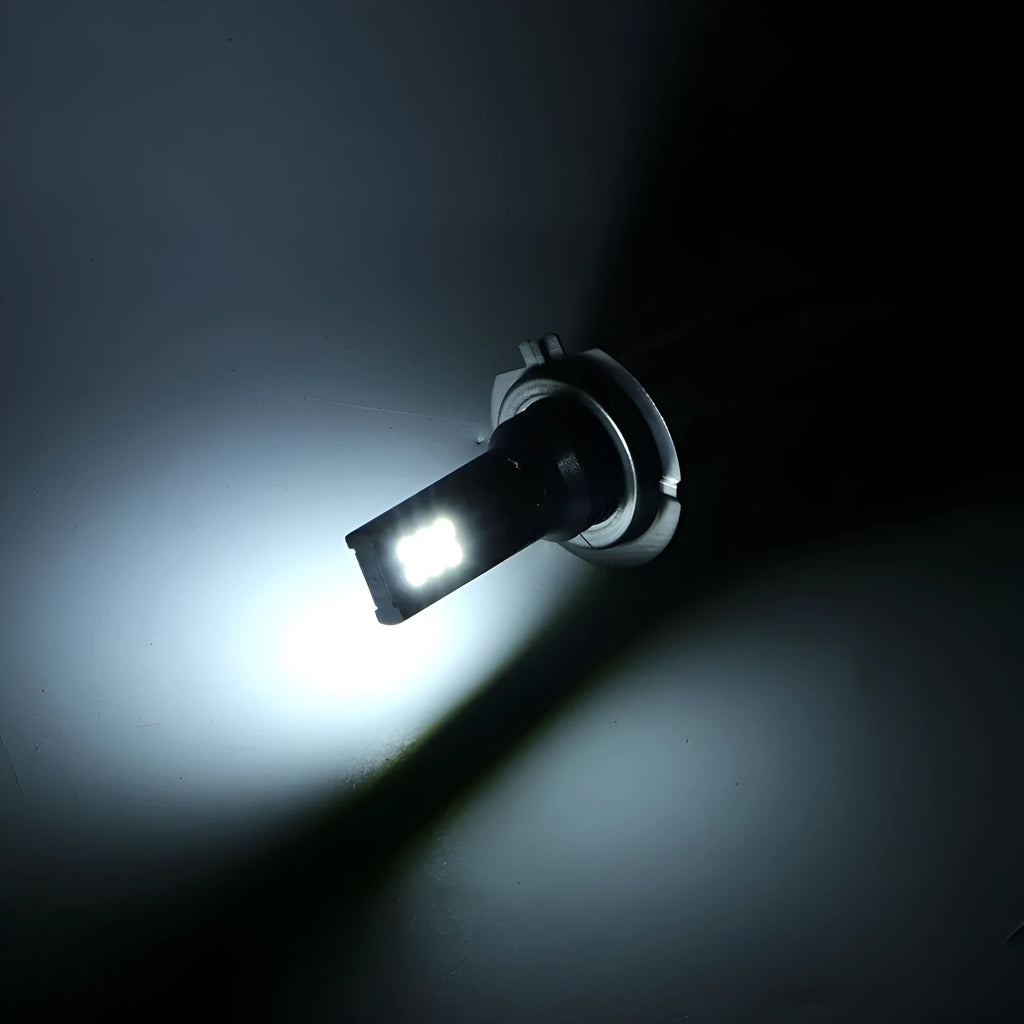 Single H7 LED fog light bulb with white housing and 12 visible SMD LEDs, packaged in an electrostatic bag.
