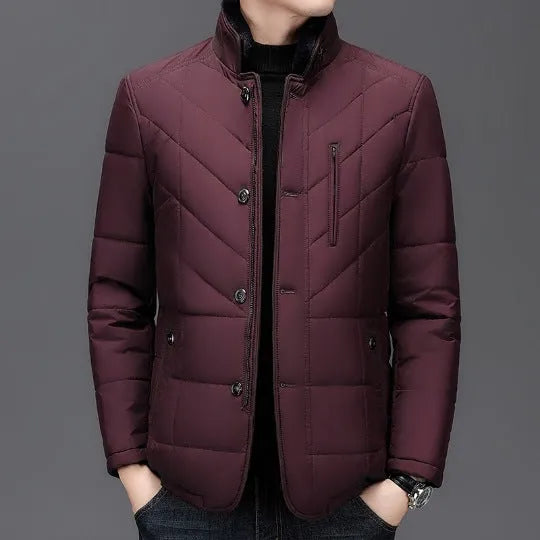 Dark blue men's short-length cotton-padded winter coat with side seam pockets on a hanger.