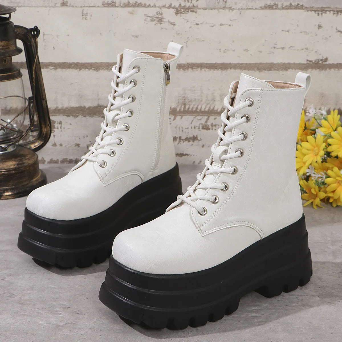 Women's white retro platform Martin boots with a chunky heel and side zipper on a neutral background.
