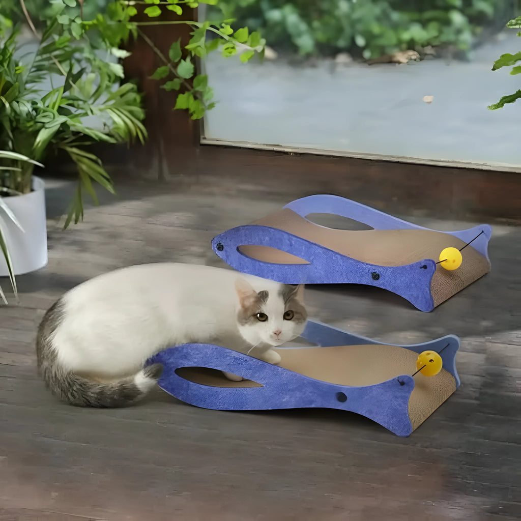 Blue fish-shaped cardboard cat scratcher with ball toy on elastic cord
