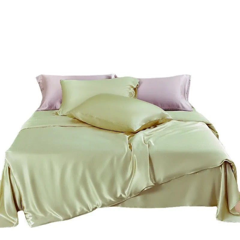 Pure silk duvet cover in a solid colour showing its sheen and texture, laid flat on a bed.