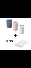Pink USB portable humidifier with LED lights and water tank on wooden desk