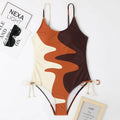 Blue sleeveless one-piece swimsuit with a backless, tight-fitting design on a mannequin.