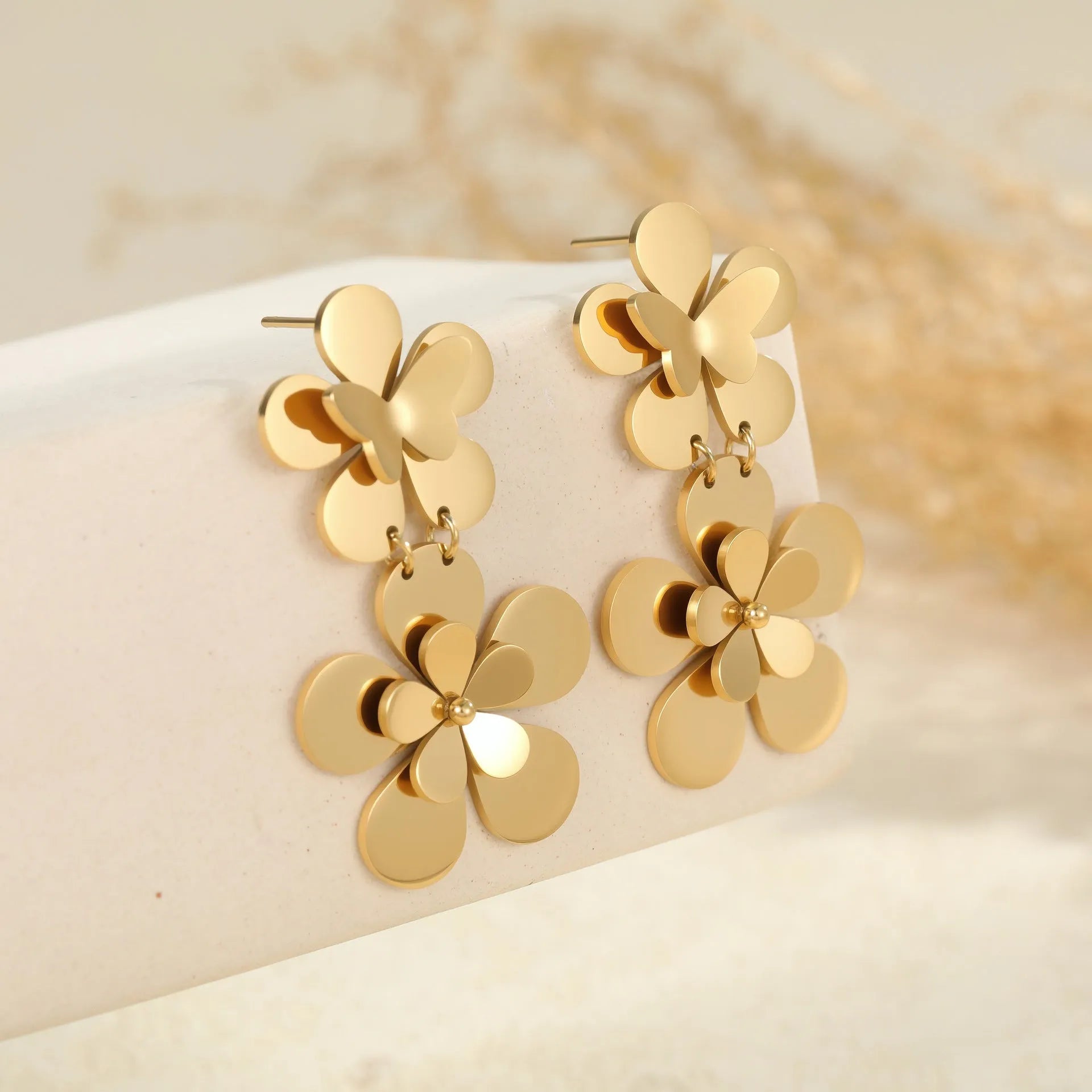 Gold flower butterfly stainless steel earrings with geometric and zodiac design elements