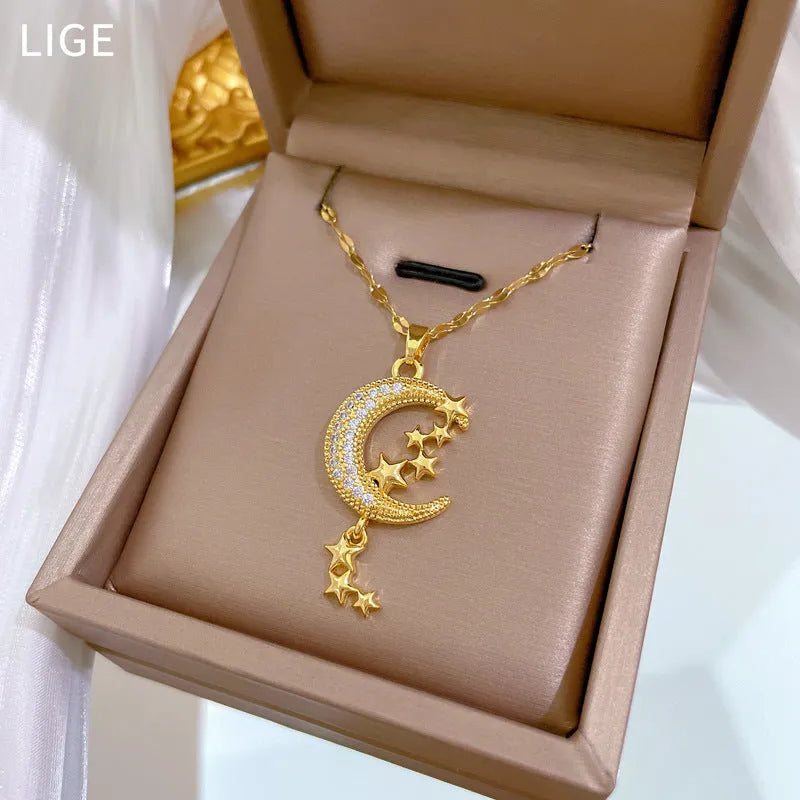 Moon pendant necklace with geometric tassel design and diamond arrangement on stainless steel chain