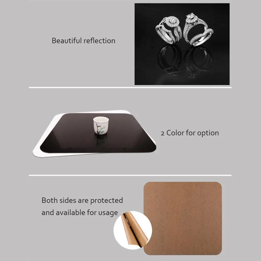 Black and white acrylic square reflection boards for product photography on a table