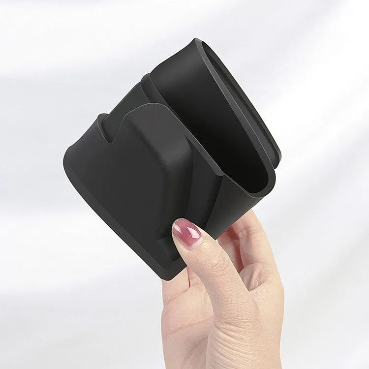 Black silicone glasses case installed in Tesla Model 3/Y centre console armrest compartment