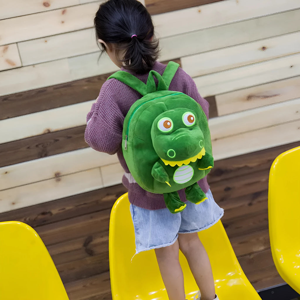 Children's dinosaur plush backpack in soft material with embroidery details and soft handle